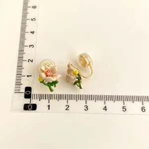 Floral clip-on earrings with cute enamel flower design and comfortable non-pierced coil back.