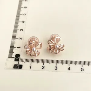 Exquisite 18K gold plated clip-on earrings with pearl and sparkling zircon flower detail.