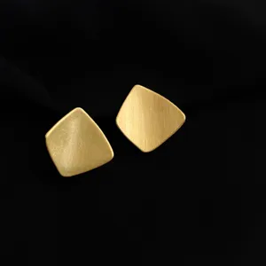 Minimalist matte gold geometric earrings, elegant brushed texture for daily wear style.