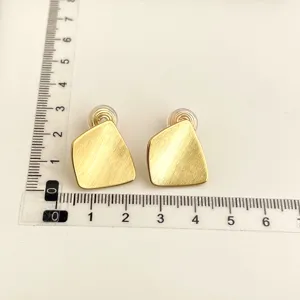 Gold geometric clip-on earrings for women, non-pierced daily commuting jewelry detail.