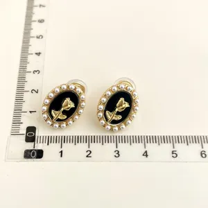 Vintage black gold rose pearl clip earrings elegant clip on earrings for non pierced ears.