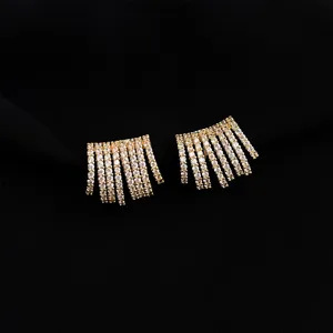Detailed close-up of gold-plated crystal fringe ear clips, sparkling zircon stones design.
