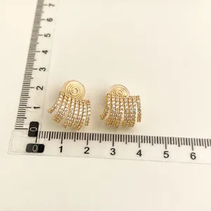 Gold-plated clip-on earrings with sparkling cubic zirconia multi-strand fringes.