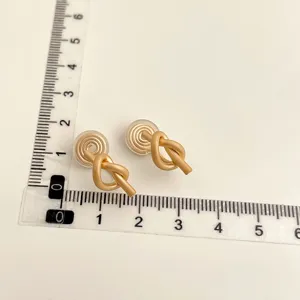 Gold plated non-pierced knot clip-on earrings, elegant minimalist daily commuter jewelry.