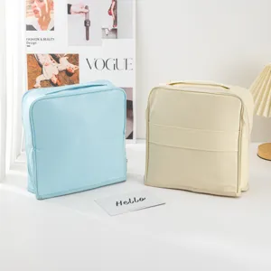 Cosmetic bag detail showcasing dual-color portable design, large capacity storage for travel.