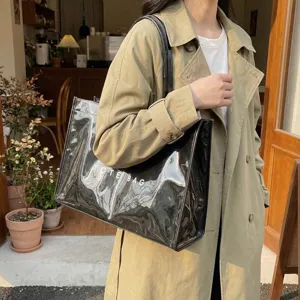 Stylish large capacity transparent PVC tote bag with handles for women daily commute use.