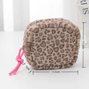 Pink plush leopard print coin purse cosmetic storage bag with cute knot zipper pull detail.