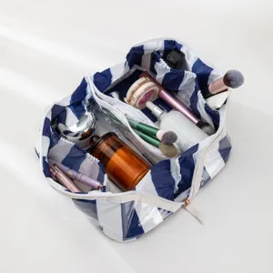 Striped PVC cosmetic bag with large capacity, waterproof travel makeup pouch and organizer.