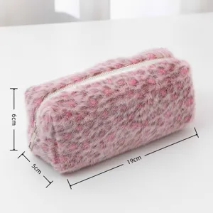 Pink plush leopard print pencil case detail view, cosmetic makeup storage pouch for travel.