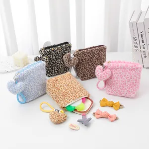 Winter vintage portable plush leopard print cosmetic bag with heart charm for women daily storage.