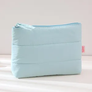 Light blue quilted cosmetic bag, fluffy travel makeup pouch, waterproof zipper storage bag.