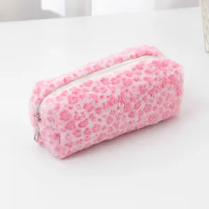 Detailed view of the pink plush leopard print pencil case, soft fabric and smooth zipper.