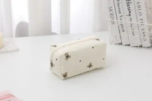 Cute corduroy makeup bag with bear embroidery, portable zipper pouch for travel and daily use.