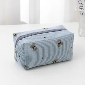 Corduroy cosmetic bag with cute bear embroidery, portable zipper makeup pouch for storage.