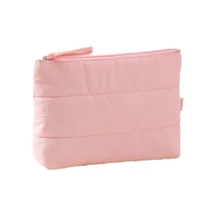 Pink quilted cosmetic bag travel makeup pouch puffy toiletry organizer with secure zipper.