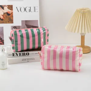 PVC striped makeup bag with zipper, portable waterproof travel cosmetic organizer pouch.