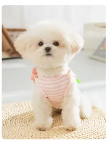Cute striped pet dog vest, pink and white summer pet apparel detail shot for small cats and dogs.