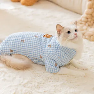 Blue gingham pet winter coat for cats and small dogs, thick warm four-legged apparel.