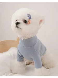 Close-up detail of the soft fleece pet base layer, showing the high collar and warm fabric.