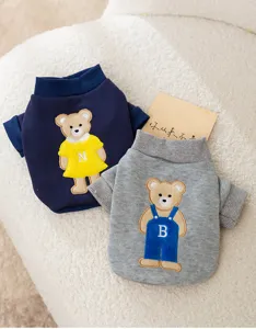 Cute cartoon bear embroidered pet dog sweatshirt detail, soft fleece fabric, comfortable fit.