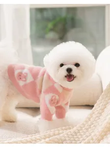 Close-up detail of the cute pink argyle pet sweater with soft faux mink fur and rabbit motif.