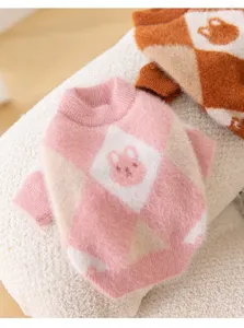 Close-up detail of the cute pink argyle pet sweater with soft bunny knit pattern.