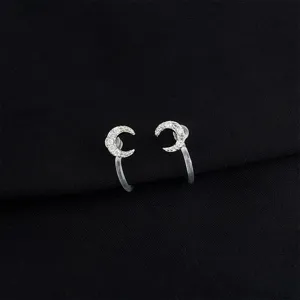 Silver crescent moon clip-on earrings adorned with sparkling cubic zirconia, clear pads
