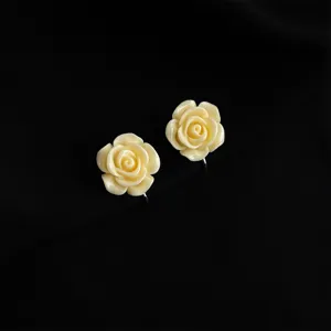 Elegant cream rose clip-on earrings for women, sweet floral non pierced ear jewelry.