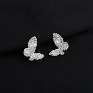 Exquisite rhinestone butterfly ear clips detail, shimmering micro-set crystals on silver.