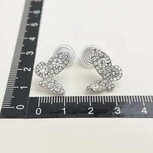 Sparkling rhinestone butterfly clip-on earrings, elegant silver tone crystal jewelry.