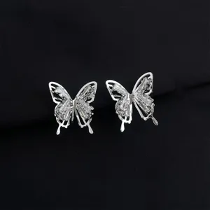 Exquisite butterfly detail showing shimmering cubic zirconia stones on silver tone metal.