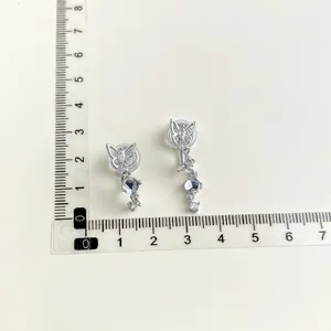 Silver butterfly clip-on earrings with sparkling crystal pendants for non-pierced ears.