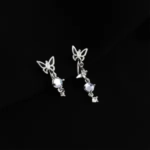 Detailed view of elegant silver butterfly clip-on earrings with shimmering stones and dangle design.