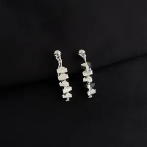 Silver geometric layered dangle ear clips featuring a modern multi-layer stacked block design.