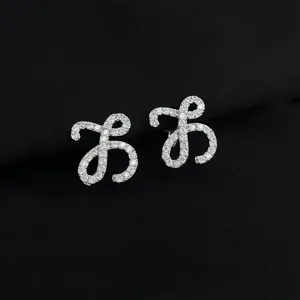 Detailed shot of micro-paved zircon butterfly earrings showcasing sparkling crystal details and craft.