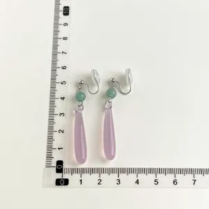 Clip-on earrings with green beads and light purple drop pendants for non-pierced ears.