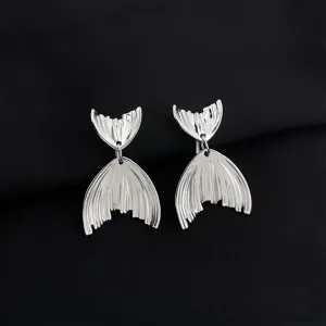 Silver fish tail earrings detail close-up, elegant alloy jewelry design showcase display.