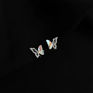 Detail shot of double-layer butterfly non-pierced ear clips with crystals for women.
