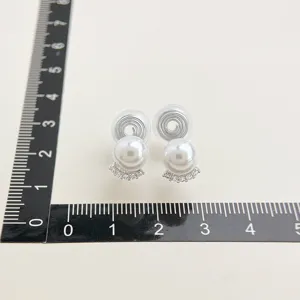 Pearl clip-on earrings with delicate micro-set zircon curves and invisible coil design.