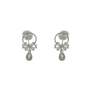 Close-up detail of silver-tone clip-on earrings featuring micro-inlaid zirconia bow and teardrop pendant.