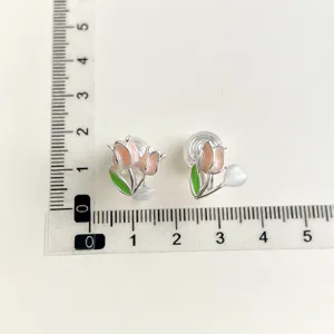 Charming tulip clip-on earrings with pink flowers and green leaves, detailed size view.