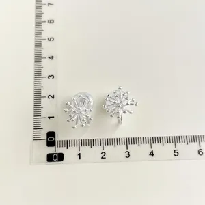 Silver tone clip-on earrings featuring delicate cluster bead design for non-pierced ears.