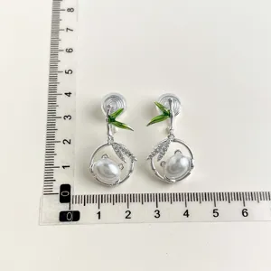 Elegant pearl and bamboo design clip-on earrings, chic non-pierced jewelry for women.