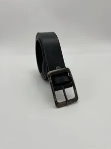 Detail view of black men's casual faux leather belt with vintage metal pin buckle texture.