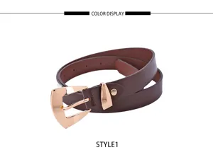 Close-up detail of women's slim brown belt with stylish rose gold metal buckle casual wear.