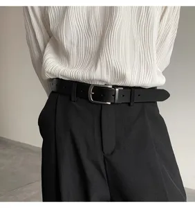 Detailed view of stylish men's black leather belt with silver pin buckle for casual look.