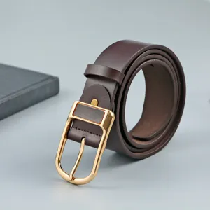 Close-up detail of a dark brown men's PU leather belt featuring a classic gold-tone buckle.