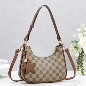 Stylish women shoulder hobo bag with monogram pattern, brown leather trim and star charm.