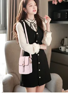 Detailed view of the pink retro monogram crossbody phone bag, compact and stylish everyday accessory.