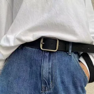 Minimalist black leather belt with matte silver square buckle detail shot for daily outfits